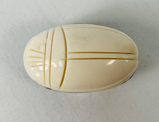 Late 19th to early 20th century East Asian bone scarab carving displayed on stand