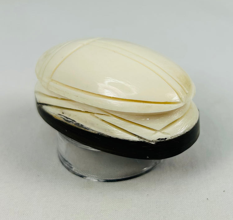 Carved symbolic scarab-shaped talisman from East Asia with elegant layered detailing