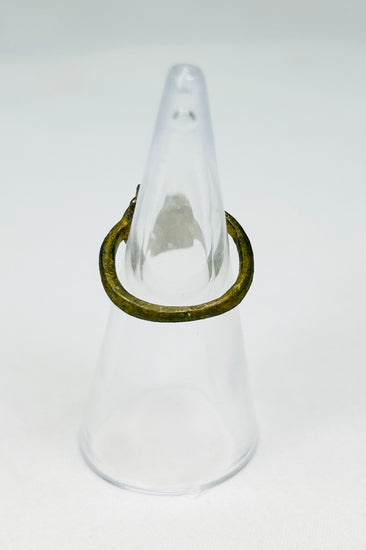 Rear view of ancient Roman bronze ring showing age wear, cracking, and craftsmanship