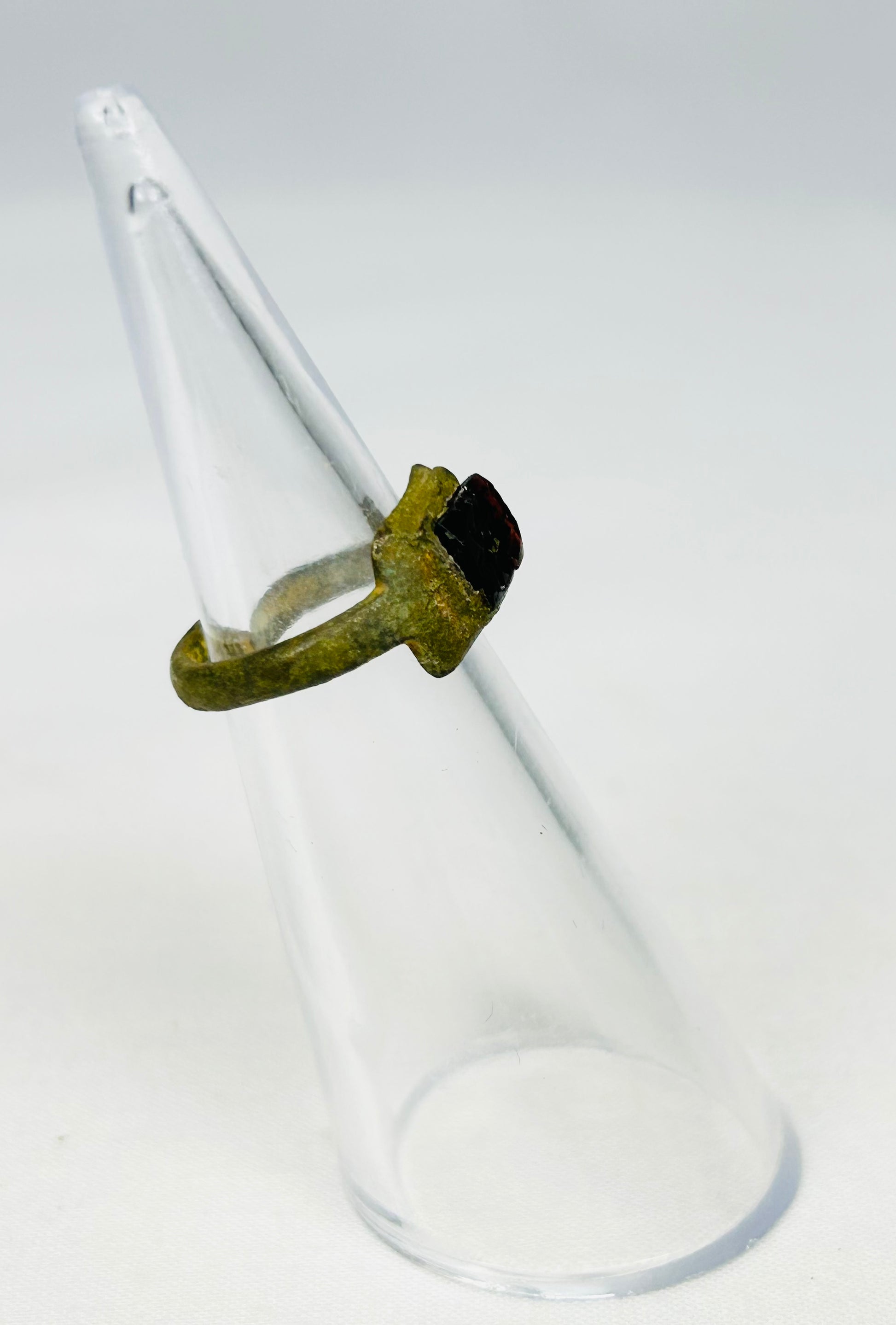 Three-quarter angled view of 2nd-century Roman bronze ring showing authentic aging