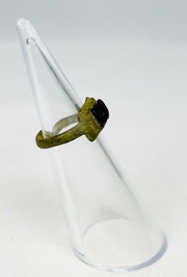 Three-quarter angled view of 2nd-century Roman bronze ring showing authentic aging