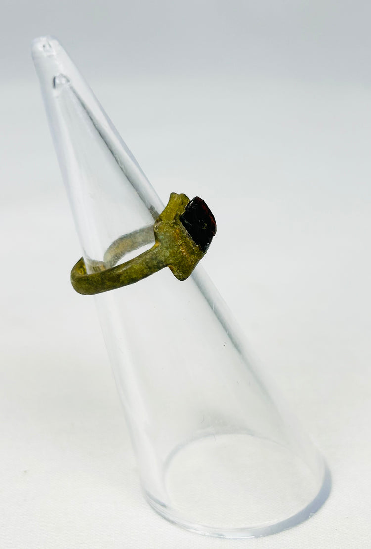 Three-quarter angled view of 2nd-century Roman bronze ring showing authentic aging