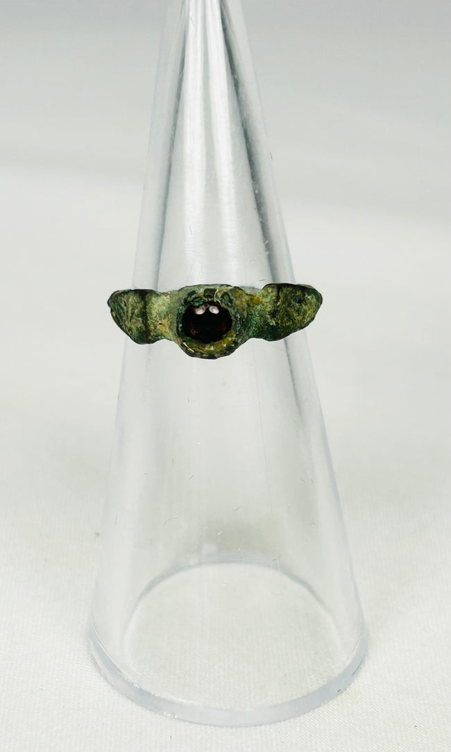 Authentic Roman Empire bronze finger ring with oval garnet stone centerpiece
