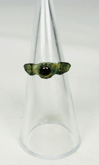 Authentic Roman Empire bronze finger ring with oval garnet stone centerpiece