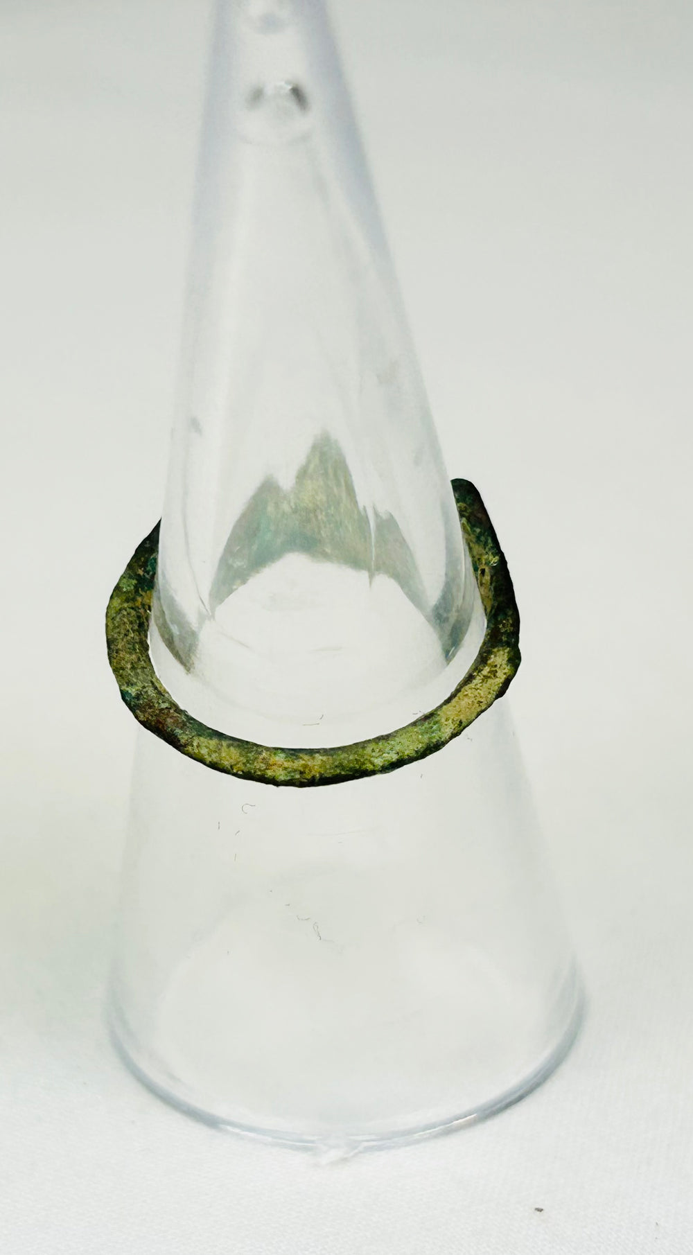 Back view of 2nd-century Roman bronze ring showing sculpted shoulders and gemstone clarity