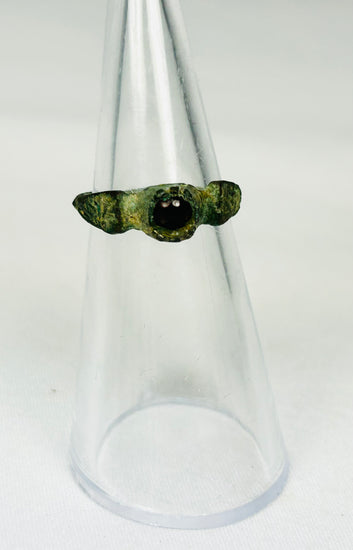 Luxury ancient Roman jewelry piece featuring garnet gemstone with cultural significance