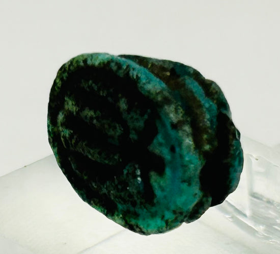 Collectible New Kingdom Egyptian scarab with aged blue glaze and strong carved detail