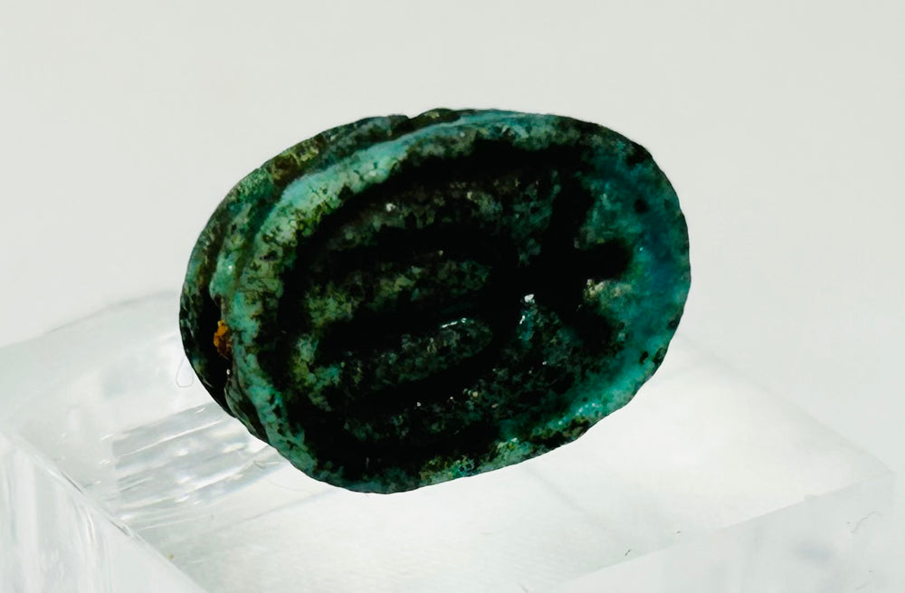 Cultural Egyptian scarab talisman representing rebirth, protection, and divine symbolism