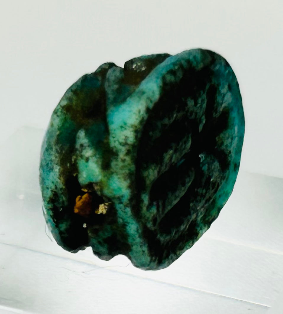 Archaeological Egyptian scarab beetle charm with preserved glaze and symbolic design