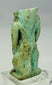 Ancient Egyptian faience amulet depicting dwarf-god Bes associated with protection and joy