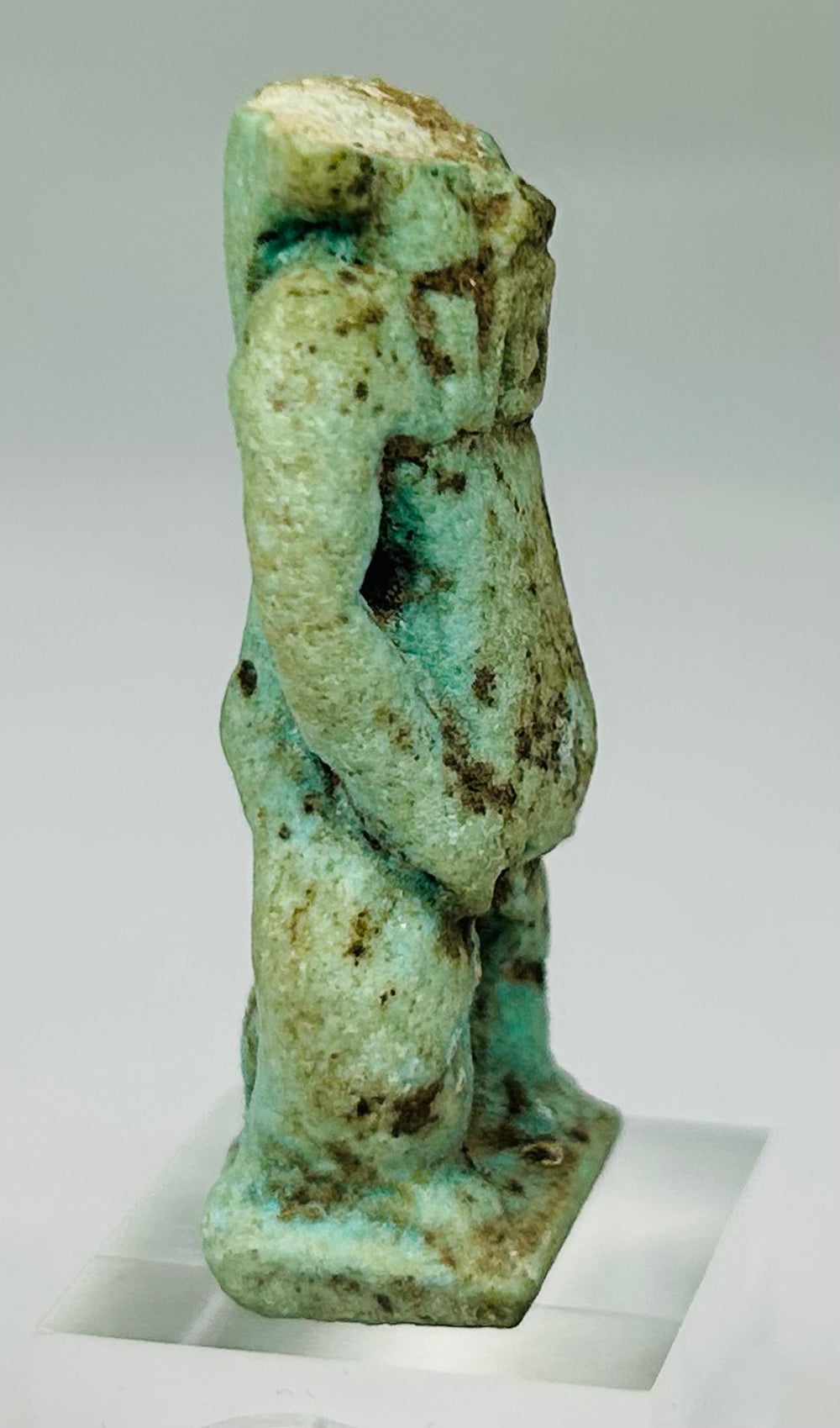 Turquoise-blue Ancient Egyptian deity amulet with desert encrustation and historical wear