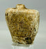 Small carved limestone or calcite flask with mineral deposits and ancient wear