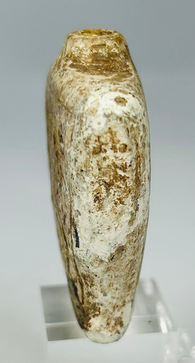 Antique stone amulet flask with tapered square body and aged earthen surface