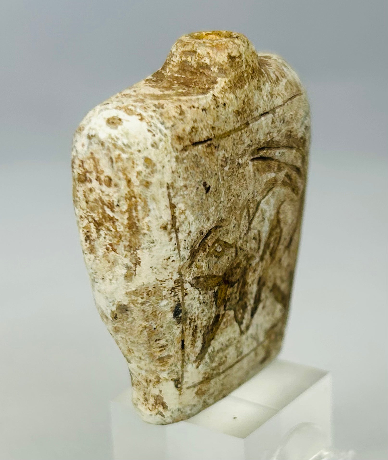 Ancient stone flask charm with drilled suspension neck and encrusted patina