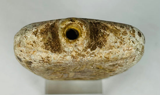 Ancient Mediterranean amulet flask relic with symbolic figures and protective meaning