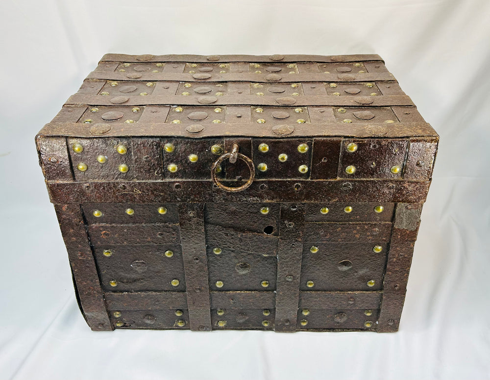 Antique Spanish or Portuguese iron-bound strong chest with riveted strapwork, brass details, and original painted interior traces