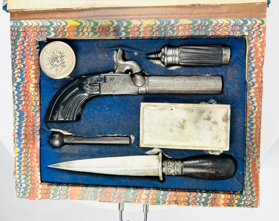 Antique Victorian concealed weapon ensemble with pistol, dagger, flask, and accessories in fitted case