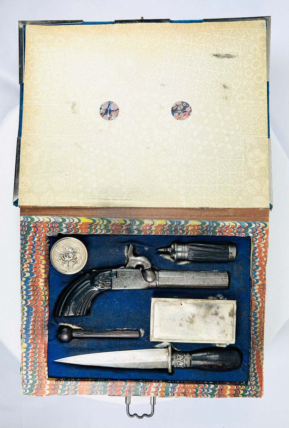Mid-19th century Liège percussion pistol and dagger defense kit hidden inside velvet-bound faux book