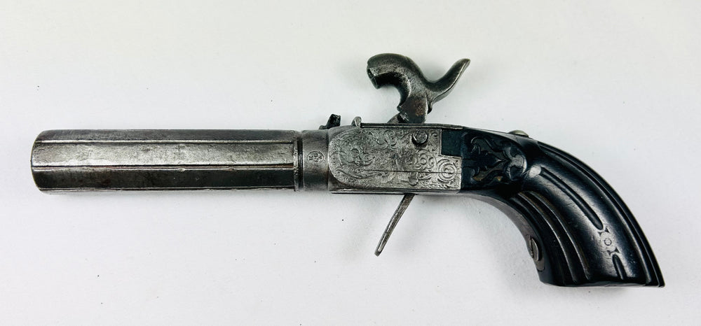 Elegant velvet-covered faux book containing pistol, dagger, ammunition containers, and tools