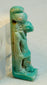 Ancient Egyptian protective faience amulet of Horus with mineral deposits and glaze wear