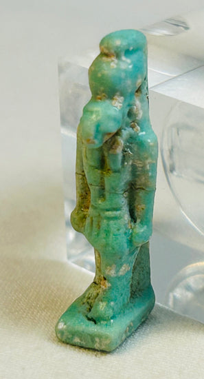 Small blue-green faience figure of falcon god Horus from Late to Ptolemaic Egypt