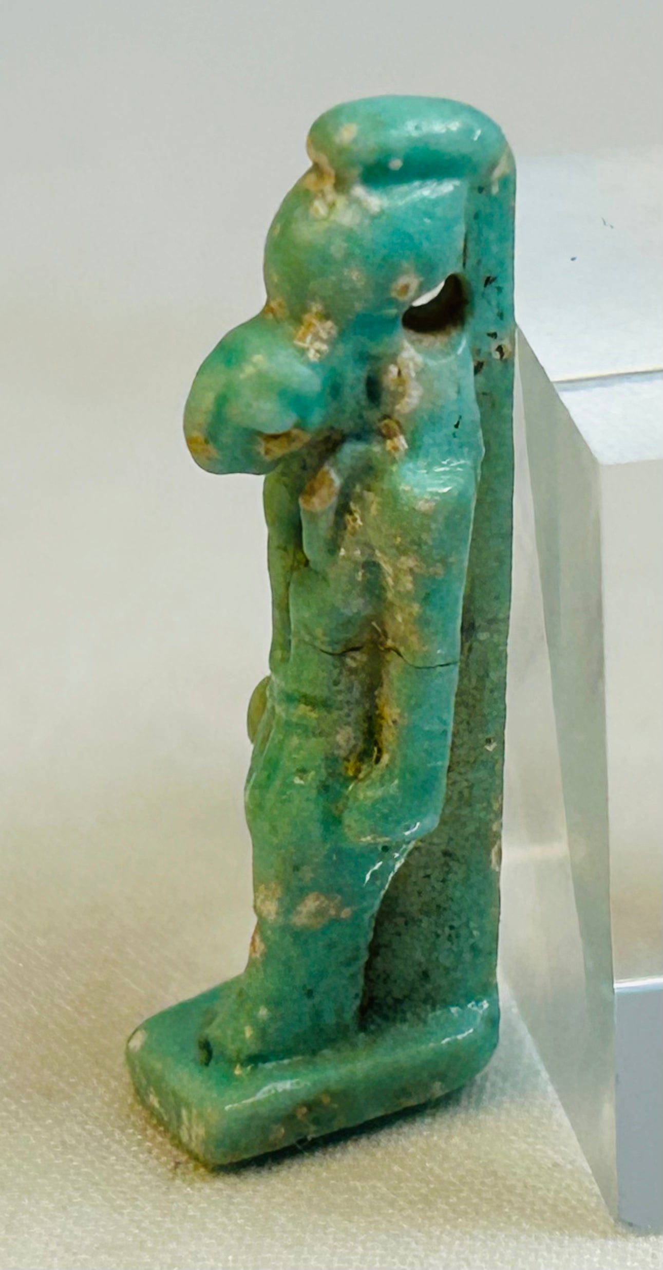 Ancient Egyptian Horus deity amulet displaying squared base and back pillar support