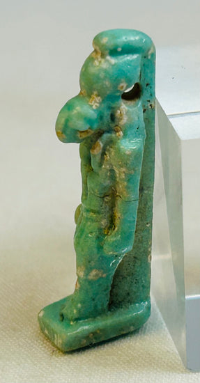 Ancient Egyptian Horus deity amulet displaying squared base and back pillar support