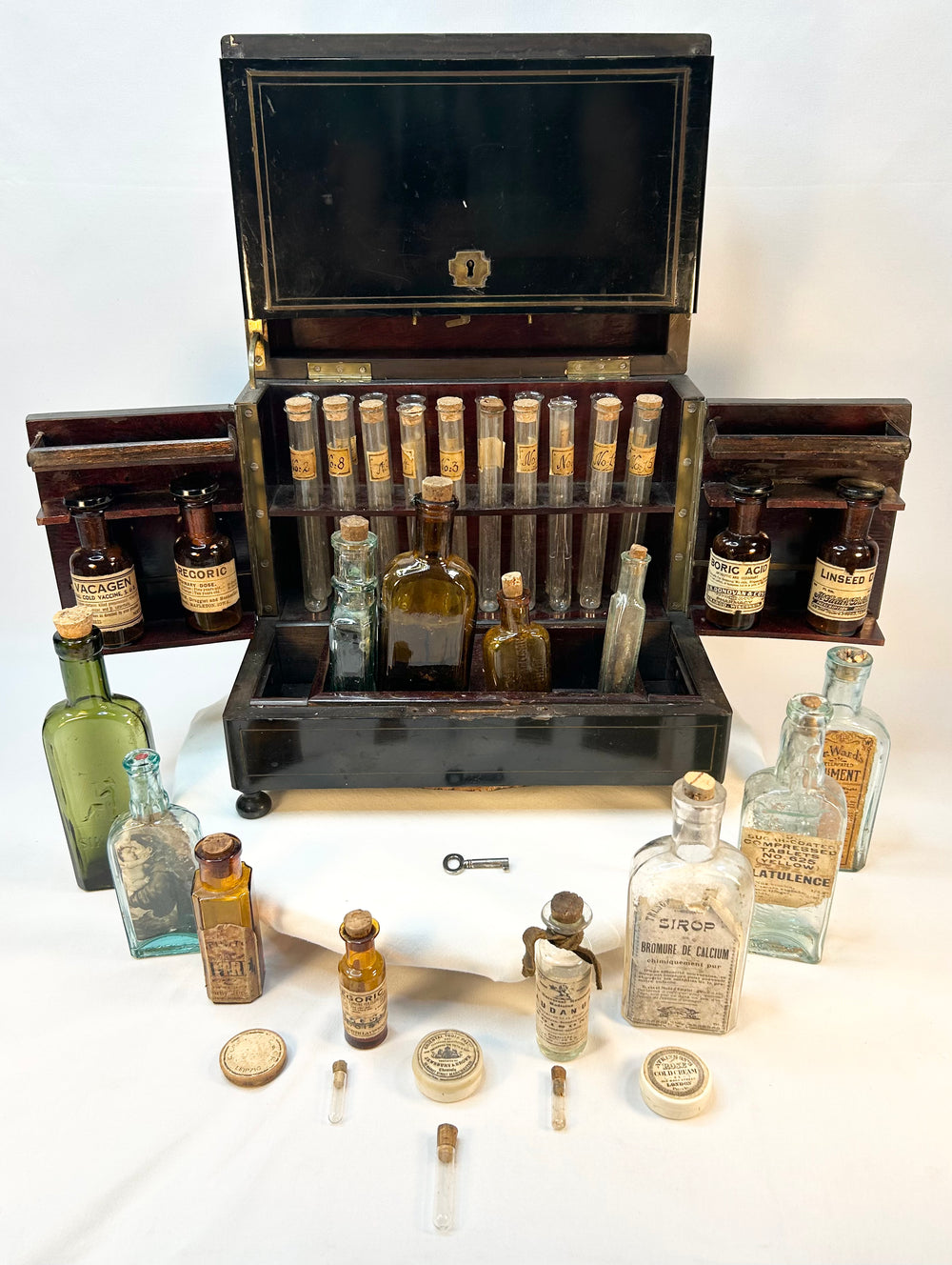 Victorian medical cabinet interior with removable storage trays and compartments