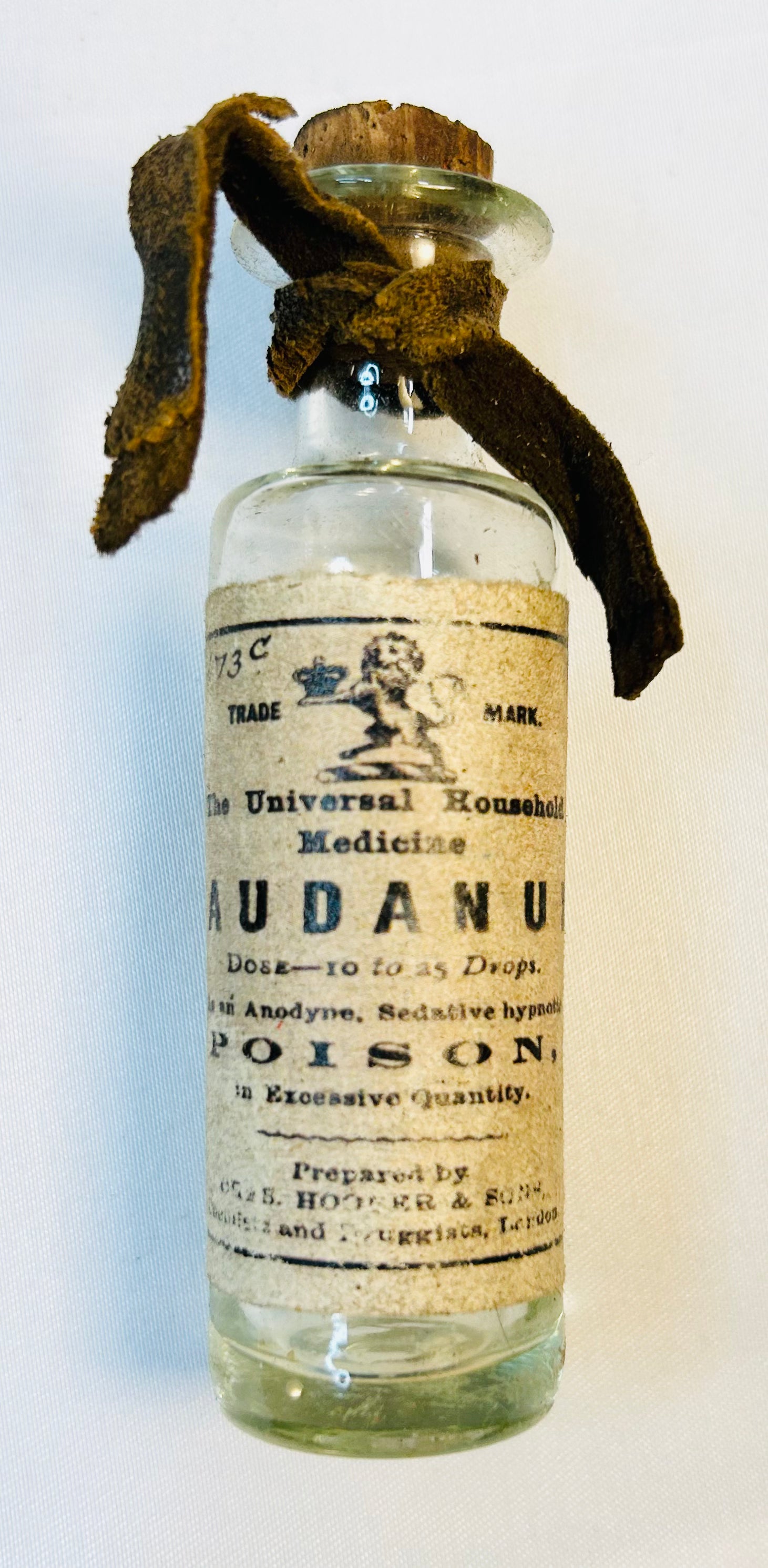 Antique laudanum poison bottle with original Victorian pharmaceutical label