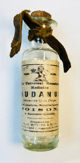 Antique laudanum poison bottle with original Victorian pharmaceutical label