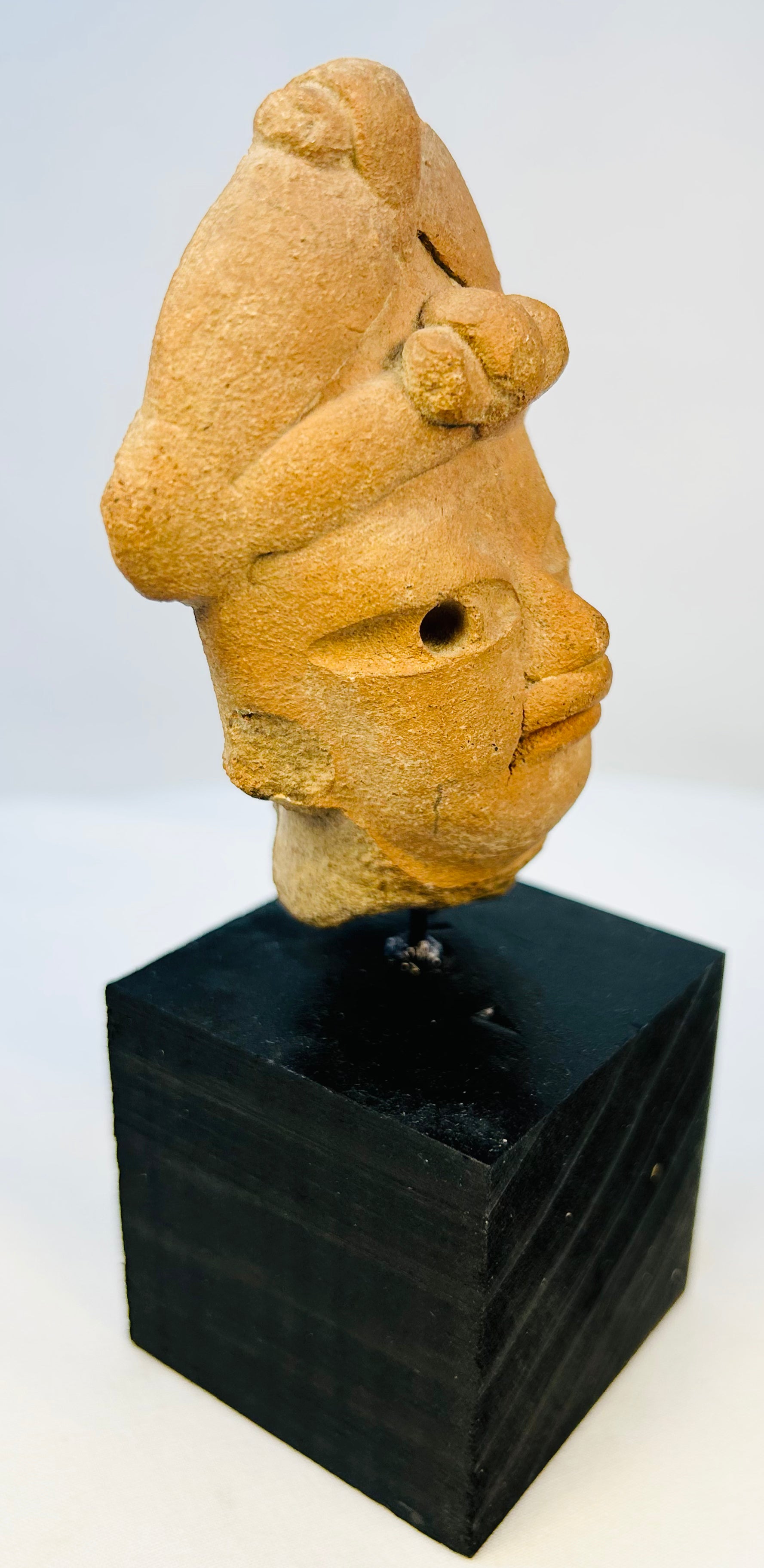 Ancient West Mexico terracotta artifact with expressive facial carving