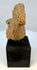 Ancient Mesoamerican terracotta sculpture fragment mounted for display