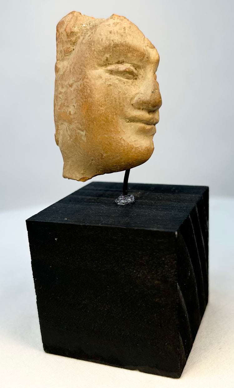 Side profile of Classical Mediterranean terracotta portrait fragment
