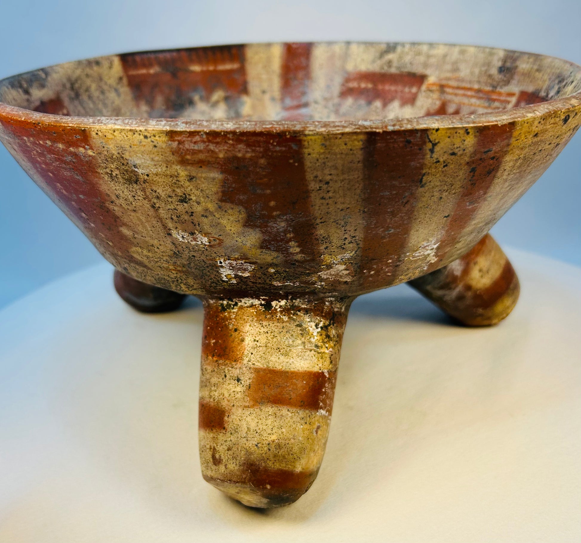 Museum-quality Pre-Columbian tripod vessel displayed on neutral background