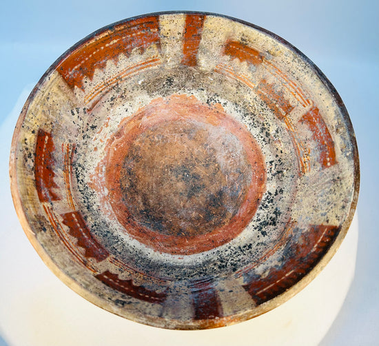 Terracotta tripod ritual bowl with original painted surface and mineral encrustation