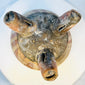 Underside view of ancient West Mexican tripod bowl showing hollow legs