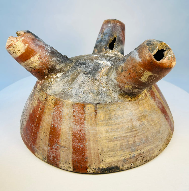 Close-up of tripod bowl legs showing hollow sound chamber openings