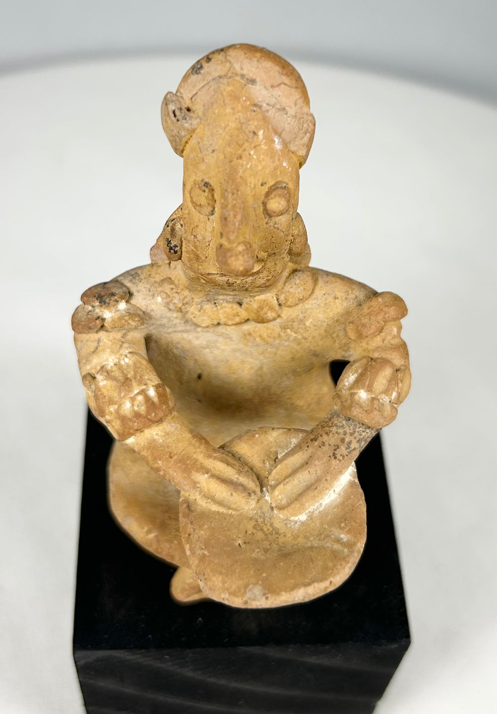 Pre-Columbian West Mexico shaft tomb terracotta figure seated with drum, displaying detailed cultural craftsmanship