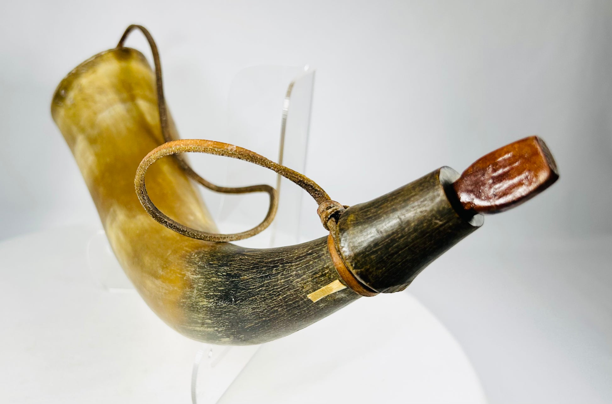 Original 1800s powder horn with hand-fitted base plug, natural coloration, and old collection tag