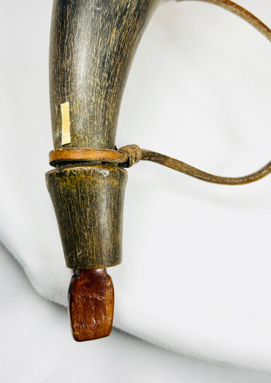 Authentic 1800s North American powder horn artifact with wood stopper, strap, and period wear