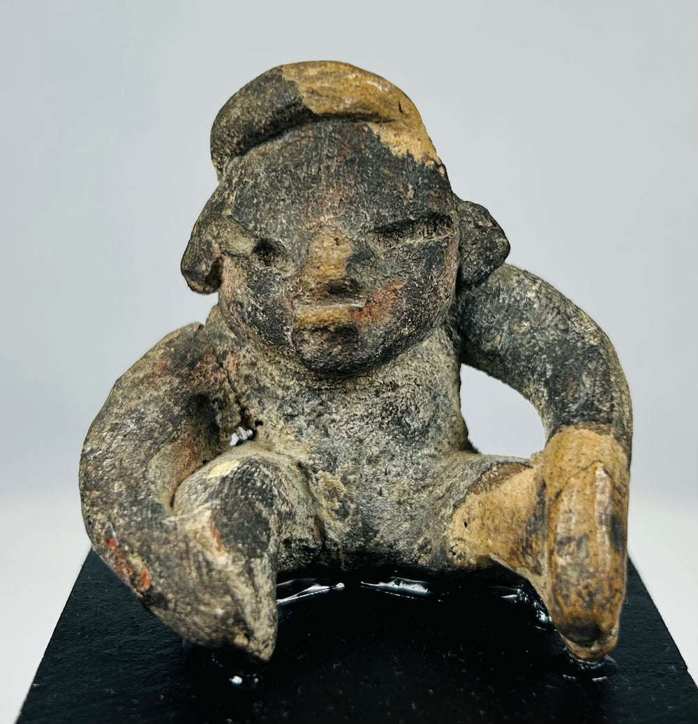 Pre-Columbian shaft tomb terracotta figure from West Mexico with compact seated posture and ritual presence
