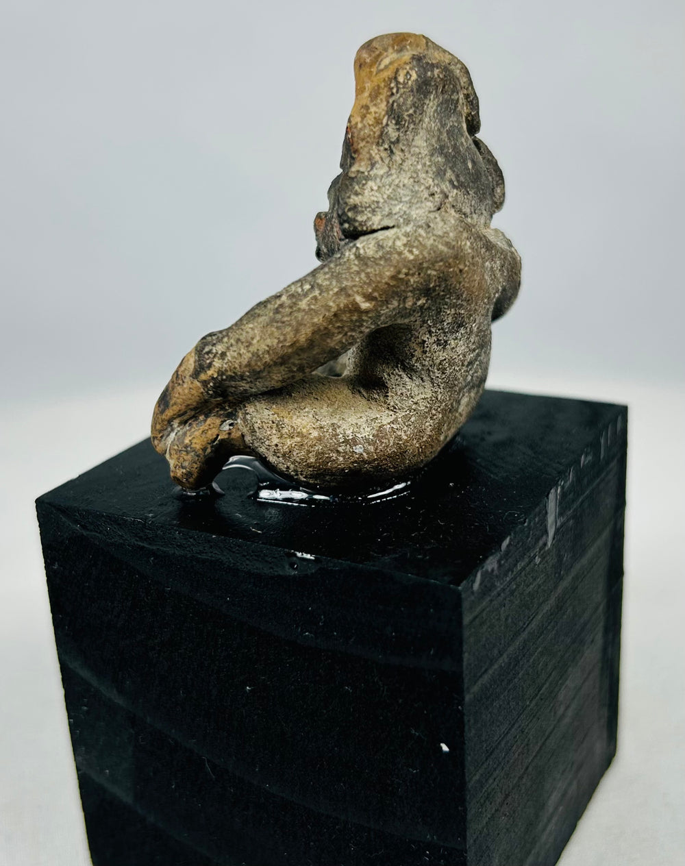 Anthropomorphic terracotta figure from ancient West Mexico with compact body form and ritual symbolism