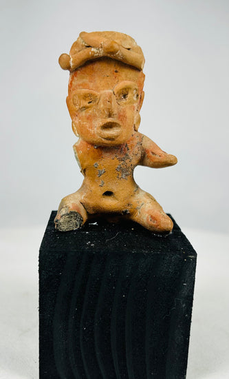 Pre-Columbian Nayarit or Jalisco terracotta burial figure with expressive features and traditional seated posture