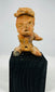 Pre-Columbian Nayarit or Jalisco terracotta burial figure with expressive features and traditional seated posture