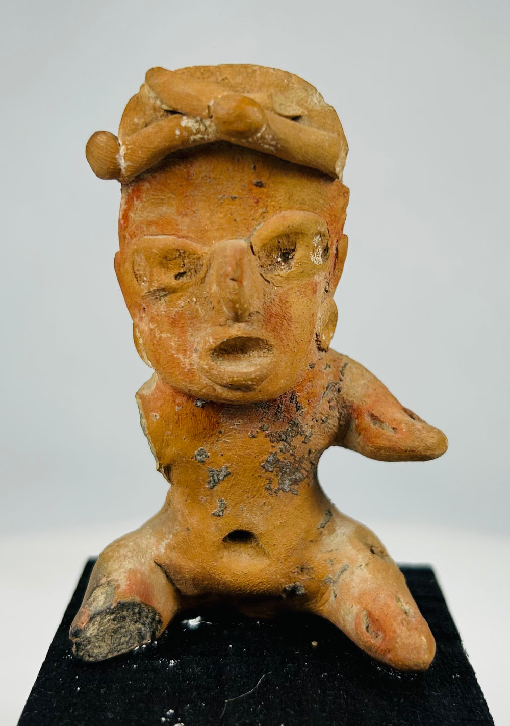 Authentic West Mexican shaft-tomb terracotta figure showing pierced ears, head adornment, and archaeological patina