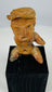 Ancient Mesoamerican terracotta seated figure with defined brows, open mouth expression, and ritual presence