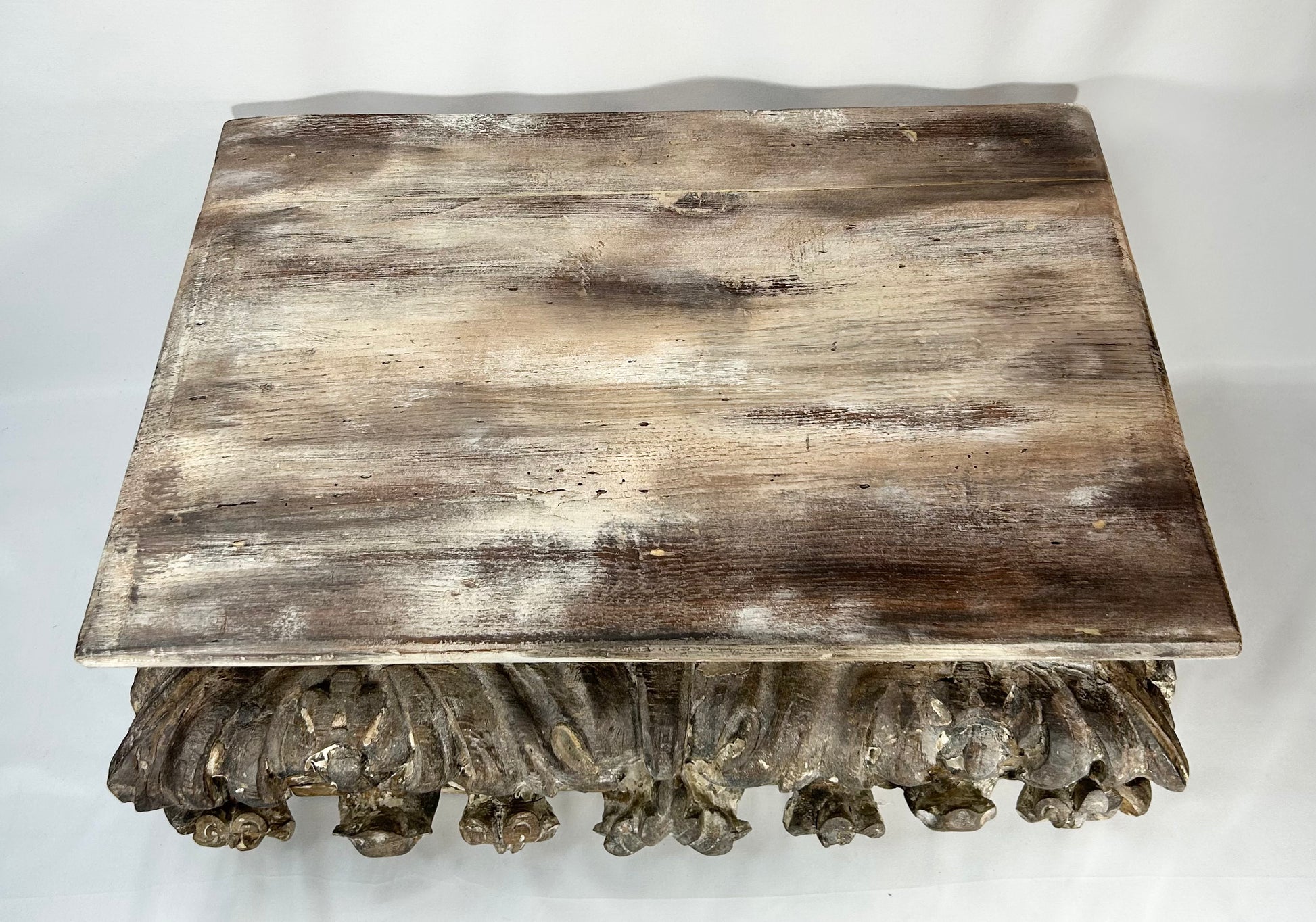 Southern European Baroque style wood pedestal with acanthus scroll carving and aged patina