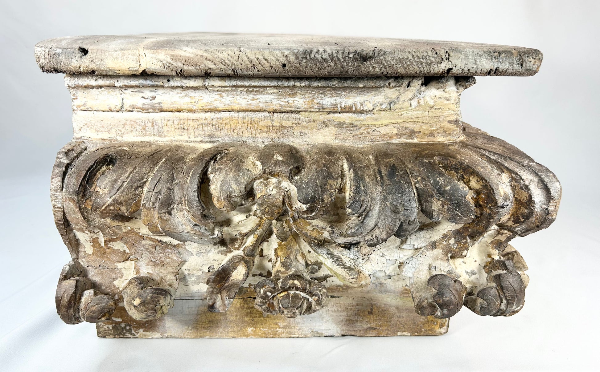 Hand-carved antique wood architectural ornament with deep relief carving and distressed finish