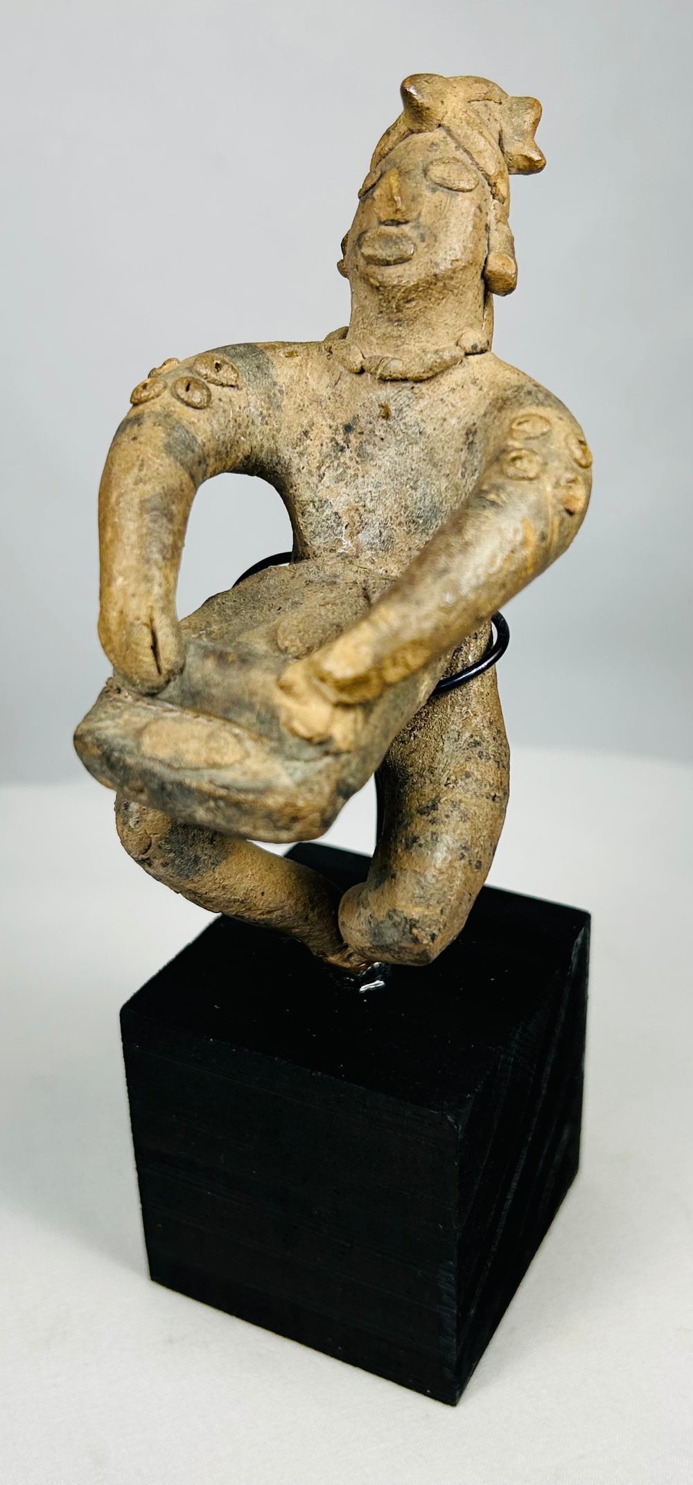 Pre-Columbian seated figure with offering vessel and burial patina