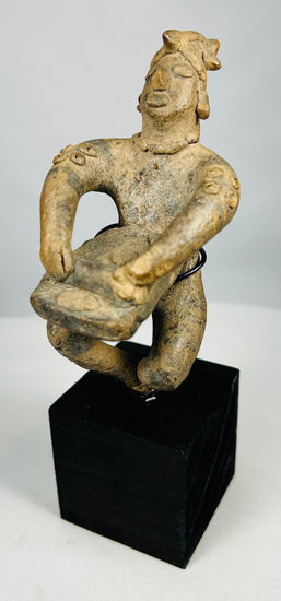 Pre-Columbian seated figure with offering vessel and burial patina